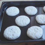 The dough has been made into buns Buns awaiting for their turn in the oven